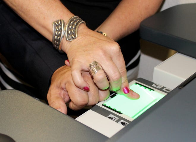 Flagler County Commissioner Nate McLaughlin provides fingerprints while applying for a concealed weapons permit at the Flagler County Tax Collector's Office in Bunnell. PHOTO PROVIDED/FLAGLER COUNTY