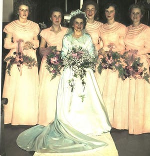 Ellie Gay as a bride in 1948. She was taking lesson on the organ to become a church organist .