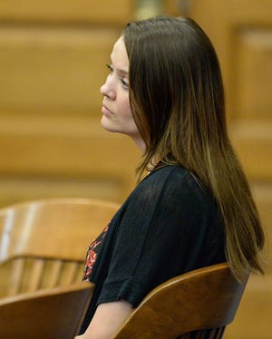 Colleen McKernan, accused of killing her husband Rob, watches as the prosecution and defense review questions from the jury in Stark County Common Pleas Court on Thursday. (GateHouse Ohio Media / Michael Balash)