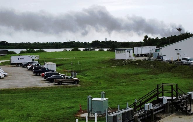 Smoke rises from a SpaceX launch site at Cape Canaveral Thursday morning. NASA said SpaceX was conducting a test firing of its unmanned rocket when a blast occurred. 

Marcia Dunn / AP Photo