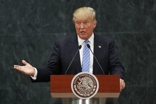 Republican presidential candidate Donald Trump speaks during a joint statement with Mexico's President Enrique Pena Nieto in Mexico City, Wednesday, Aug. 31, 2016. Trump is calling his surprise visit to Mexico City Wednesday a 'great honor.' The Republican presidential nominee said after meeting with Pe‡±a Nieto that the pair had a substantive, direct and constructive exchange of ideas.(AP Photo/Dario Lopez-Mills)