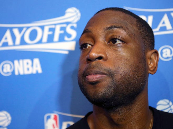 FILE - In this April 28, 2016, file photo, then-Miami Heat guard Dwyane Wade, speaks with the media after basketball practice in Miami. Wade has lashed out against his hometown of Chicago's gun laws, calling them weak and saying he's already urged city officials to enact changes to help both citizens and police. Wade spoke out to ABC News in an interview that aired Friday, one day before the funeral for his cousin Nykea Aldridge - a mother of four who was shot and killed on a Chicago street last week. (David Santiago/El Nuevo Herald via AP, File)