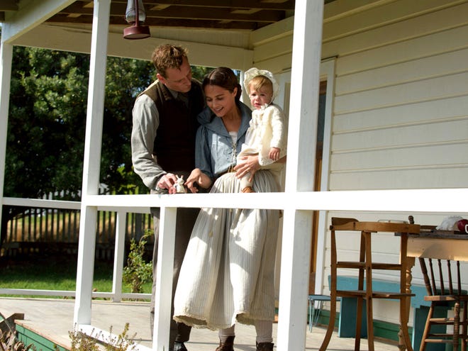 Happy time as a family doesn’t last forever in Derek Cianfrance’s new film, “The Light Between Oceans.” (Heyday Films)
