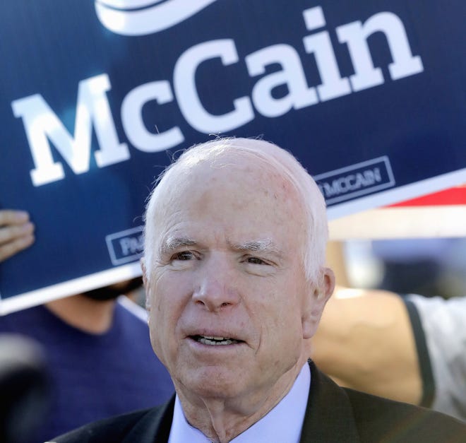 FILE - In this Aug. 30, 2016 file photo, Sen. John McCain, R-Ariz. speaks outside a polling station after voting, in Phoenix. McCain and Sen. Marco Rubio, R-Fla., turned toward the general election Wednesday, Aug. 31, 2016, with GOP control of the Senate at risk, each facing lesser-known Democratic House members who've sought to link them to Donald Trump. (AP Photo/Matt York, File)