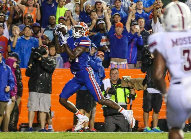 Gary McCullough For The Times-Union Florida wide receiver Antonio Callaway catches a pass in the end zone for a touchdown against UMass on Saturday night in Gainesville.