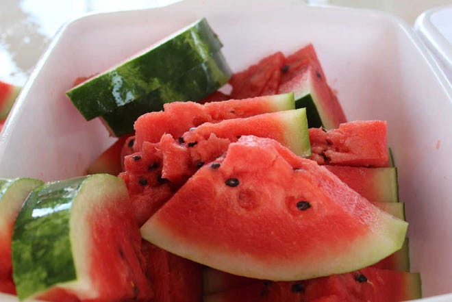 Fresh slices were free to visitors Saturday to Yoakum County's annual Watermelon Roundup.