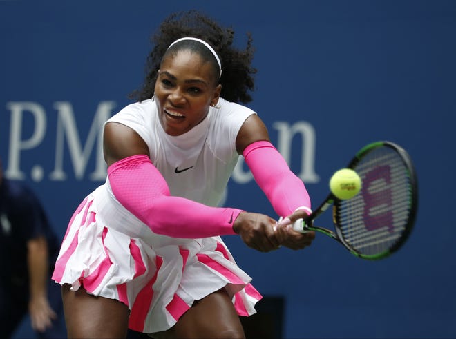 Serena Williams returns a shot during her 6-2, 6-1 victory over Johanna Larsson in the third round of the U.S. Open on Saturday. AP Photo/Jason DeCrow