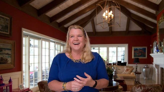 Danielle Moore, shown at her home, joined the council in 2015 by unseating incumbent Bill Diamond. She is the stepdaughter of late Palm Beach Mayor Earl E.T. Smith and daughter of former Mayor Lesly Smith. Allen Eyestone / Daily News