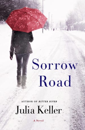 This book cover image released by Minotaur shows "Sorrow Road," by Julia Keller. (Minotaur via AP)