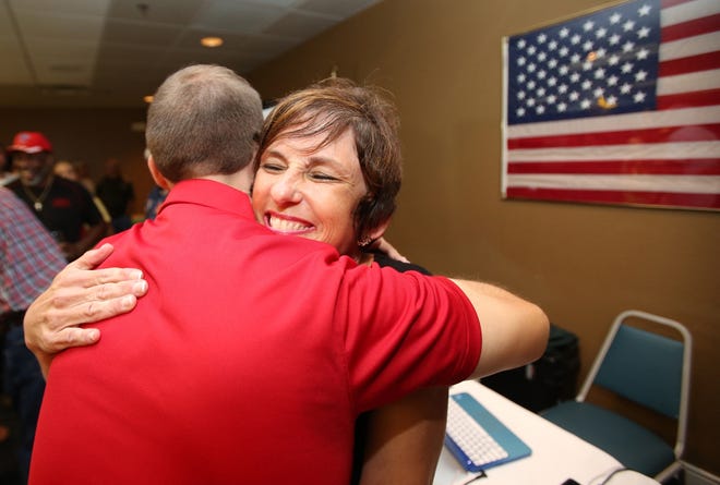 Heidi Maier gets a hug from Paul Skinner of the Florida Federation of Young Republicans after Maier defeated incumbent George Tomyn in the primary election for the Superintendent of Marion County Public Schools on Aug. 30. (Bruce Ackerman/Star-Banner)