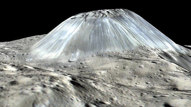 Ceres's lonely mountain, Ahuna Mons, is seen in exaggerated color. MUST CREDIT: NASA/JPL-Caltech/UCLA/MPS/DLR/IDA/PSI