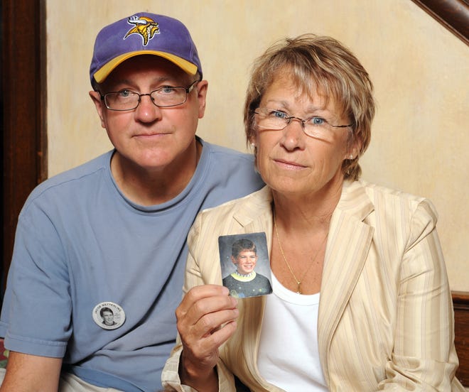 In this 2009 photo, Patty and Jerry Wetterling show a photo of their son Jacob Wetterling, who was abducted in October of 1989 in St. Joseph, Minn. ASSOCIATED PRESS FILE / CRAIG LASSIG