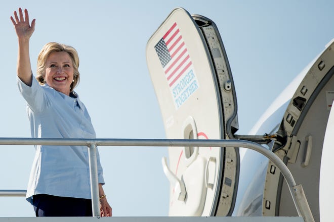 Democratic presidential candidate Hillary Clinton boards her campaign plane at Cleveland Hopkins International Airport in Cleveland, Ohio, Monday, Sept. 5, 2016, to travel to Quad Cities International Airport in Moline, Ill.