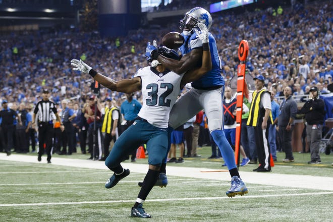 (File) Eagles cornerback Eric Rowe, shown trying to defend former Detroit Lions wide receiver Calvin Johnson, was reportedly traded to the New England Patriots on Tuesday.