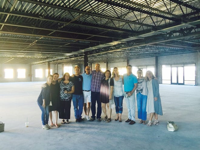 Past and present board members of the Emerald Coast Theatre Company are shown in the new space at 560 Grand Boulevard.