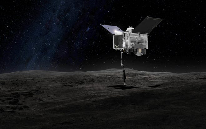 This artist's rendering made available by NASA on Tuesday shows the Origins Spectral Interpretation Resource Identification Security - Regolith Explorer (OSIRIS-REx) spacecraft contacting the asteroid Bennu with the Touch-And-Go Sample Arm Mechanism. The mission, planned for launch on Thursday, aims to return a sample of Bennu's surface to Earth for study as well as return detailed information about the asteroid and its trajectory. NASA/GODDARD SPACE FLIGHT CENTER VIA AP