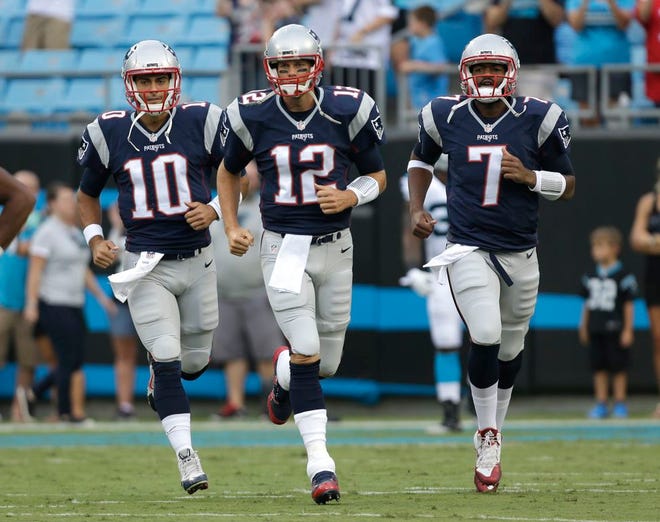 With New England Patriots quarterback Tom Brady, center, suspended, Jimmy Garoppolo, left, will open the 2016 season in the position backed up by rookie Jacoby Brissett, right.