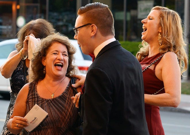 From left, Tracy Picente-Decarr laughs with Angelo DiGiorgio, who went by "Kinky Karl," and Danielle Monaski during the first ever “Kinky Boots” red carpet gala put on by Broadway Theatre League of Utica at the Stanley Center for the Arts in Utica Tuesday. The money raised will go to its new community fund called, "A Pledge for Purpose," and it will benefit the Q Center in Utica. OBSERVER-DISPATCH PHOTO/TINA RUSSELL