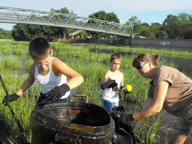 Monroe News file photo 
Residents are invited to participate in a river clean-up event Saturday.
