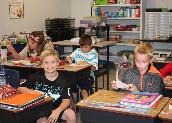 Students in teacher Katie Dwyer's fourth grade class get to work on the first day of school at Mildred L. Day School in Arundel Tuesday morning. 

Photo by: Donna Buttarazzi/Seacoastonline