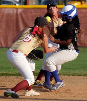 Burke County's #20 Trianna Cooper gets to second safely, beating the throw from Cross Creek's #6 Haley Provost to #2 Chloe Maggallanes during Burke County's 9-0 softball win over Cross Creek.