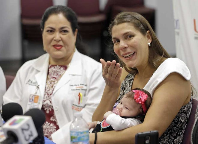 Associated Press Maria Fernanda Ramirez Bolivar, right, talks to reporters as she carries her baby Micaela Milagros Mendoza Ramirez, as physician Delia Rivera-Hernandez, left, looks on, during an August news conference. The mother contracted the Zika virus when she traveled to her native Venezuela when she was three months pregnant. She tested positive for the virus in April.