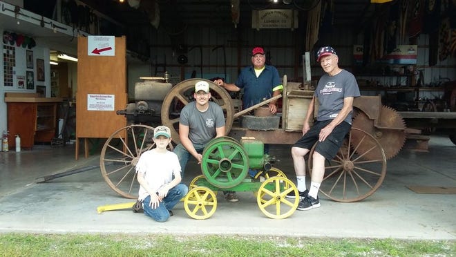 THE SECOND-ANNUAL Vintage Farm Equipment Show will be Saturday and 
Sunday, Sept. 17-18, at Bridge Park, Atkinson. Shown with some of the donated items for the event are, from left, Kaleb VanDeGenachte, John VanDeGenachte, and Dave Carton, who are part of the group organizing the vintage show, and Bill Freddy, who also helps the group and serves as curator of the Atkinson Township Historical Museum.