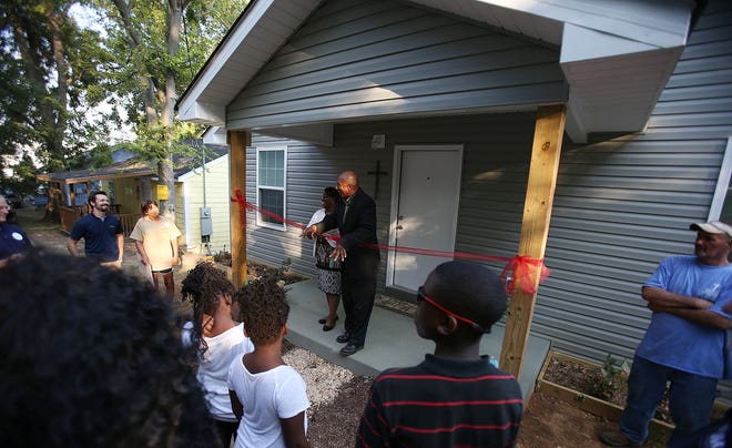 The Rev. Larry Doughty Sr. speaks during the dedication ceremony of the shelter with Project Blessings in Tuscaloosa on Thursday, Sept. 8, 2016. The home is currently equipped to house 8 men, some are set to move in over the next week. Staff Photo/Erin Nelson