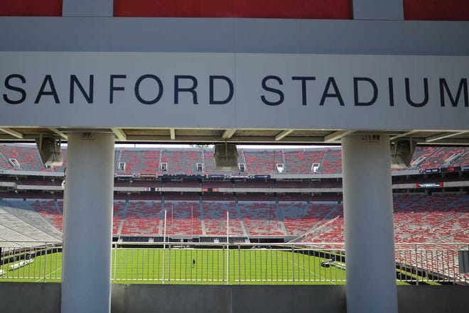 A grounds crew worker prepares Sanford Stadium for Saturday's game against South Carolina on the campus of the University of Georgia on Thursday, Sept. 17, 2015, in Athens, Ga. (AJ Reynolds/Staff, @ajreynoldsphoto)