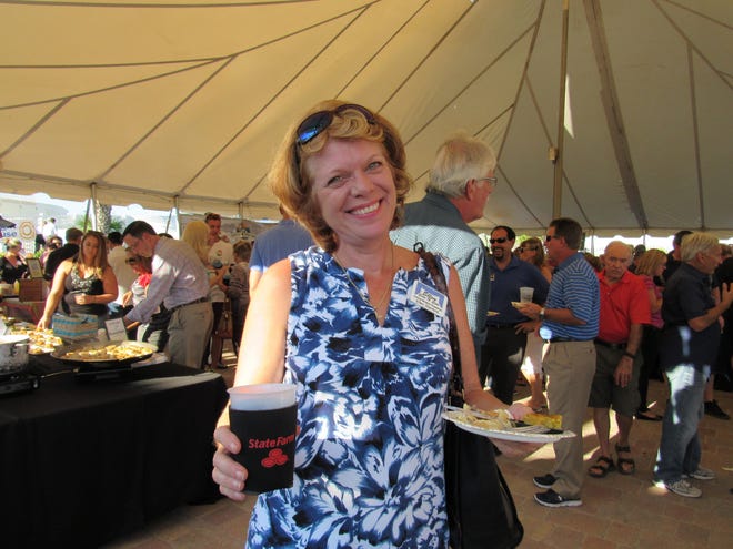 Ready to enjoy her samples, Ellen Stanford is all smiles at the VIP reception to kick off Flagler Restaurant Week at Marineland Dolphin Adventure. NEWS-TRIBUNE/DANIELLE ANDERSON