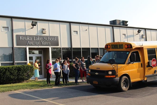 Keuka Lake School faculty greet students on the first day of school at its new facility on the Arc of Yates campus. PHOTO PROVIDED
