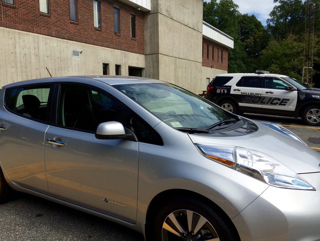 Millbury Police Department received one of the town's new electric cars, a Nissan Leaf, making it what officials say is the first police department in the state to go electric. T&G Staff/Susan Spencer