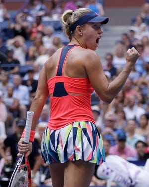 Angelique Kerber, of Germany, reacts after winning the first set against Karolina Pliskova, of the Czech Republic, during the women's singles final of the U.S. Open tennis tournament, Saturday, Sept. 10, 2016, in New York. (AP Photo/Julio Cortez)