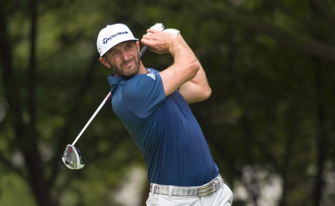 Dustin Johnson hits his tee shot on the second hole in the final round of the BMW Championship golf tournament at Crooked Stick Golf Club in Carmel, Ind., on Sunday. Associated Press/Doug McSchooler