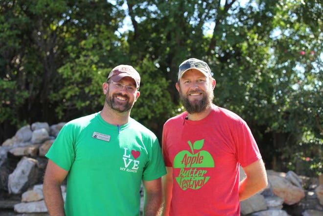 From left, Texas Boys Ranch development associate Michael Nudelman and The Orchard owner Tucker Crawford at the Apple Butter Festival on Sunday at Tucker's orchard in Idalou. (Sarah Rafique/A-J Media)