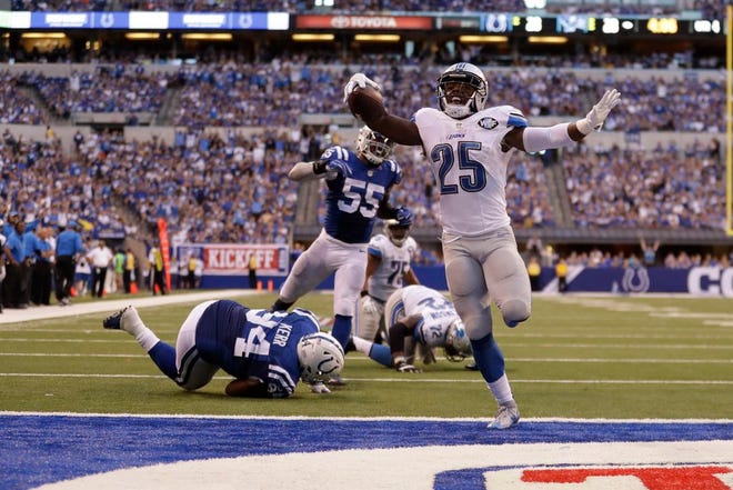 Detroit Lions running back Theo Riddick (25) celebrates as he runs in for a touchdown against the Indianapolis Colts during the first half of an NFL football game in Indianapolis, Sunday, Sept. 11, 2016. (AP Photo/Jeff Roberson)