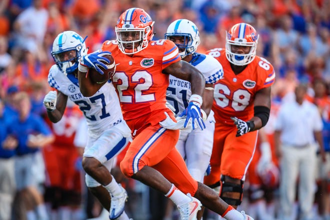 Florida freshman running back Lamical Perine scores on a 28-yard pass play against Kentucky during the fourth quarter Saturday on Steve Spurrier-Florida Field. (Rob C. Witzel/Staff photographer)