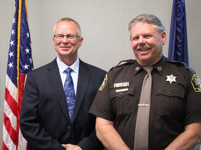 Ionia County Sheriff's Office Capt. Mark Jones (right) stands with Ionia County Sheriff Dale Miller. Jones is set to retire from the ICSO next week.