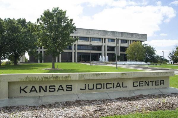 The Kansas Supreme Court wrestled Monday with whether it should censure a former Wichita-area judge over allegations that he was not candid in answering questions about earlier accusations of sexual harassment and other improper conduct.