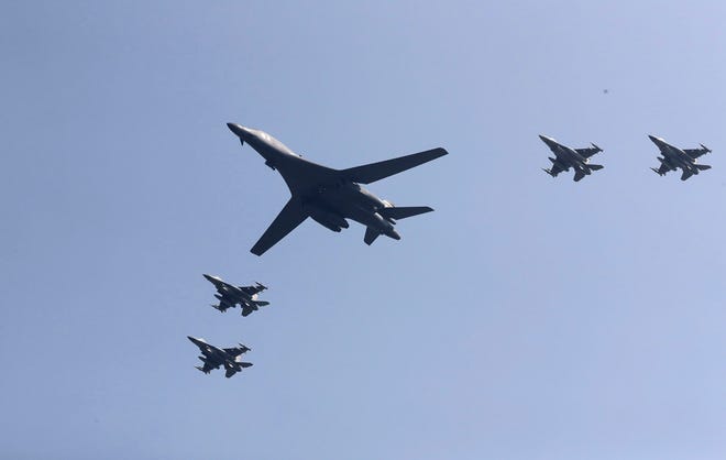 U.S. B-1 bomber, center, flies over Osan Air Base with U.S. jets in Pyeongtaek, South Korea, Tuesday, Sept. 13, 2016. The United States has flown nuclear-capable supersonic bombers over ally South Korea in a show of force meant to cow North Korea after its fifth nuclear test and also to settle rattled nerves in the South. (AP Photo/Lee Jin-man)