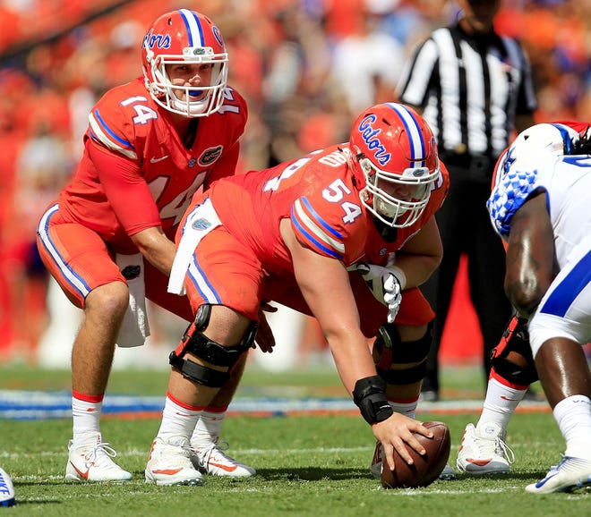 Florida quarterback Luke Del Rio lines up under center Cameron Dillard during Saturday's game against Kentucky at Steve Spurrier-Florida Field. Del Rio threw for 320 yards and four touchdowns in the win over the Wildcats. But coach Jim McElwain is expecting more production from his QB. Gatehouse Media Services/Matt Stamey
