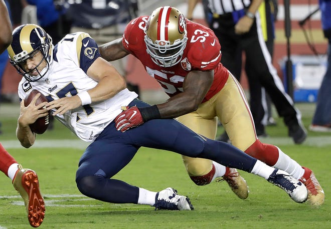Los Angeles Rams quarterback Case Keenum (17) is tackled by San Francisco 49ers linebacker NaVorro Bowman (53) during the second half of an NFL football game in Santa Clara, Calif., Monday, Sept. 12, 2016. The 49ers won 28-0. (AP Photo/Marcio Jose Sanchez)
