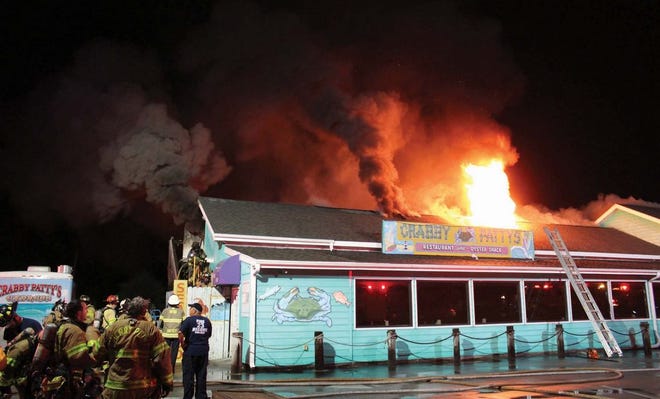 Firefighters work to put out a fire Sept. 1 at Crabby Patty's Restaurant in Havelock. Investigators determined an electrical problem caused the fire.