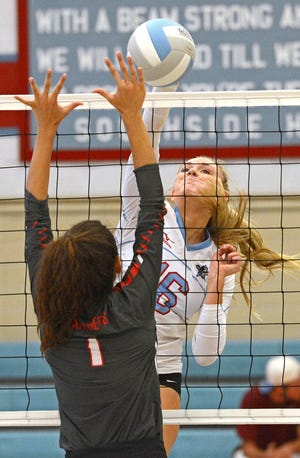 Southside's Madison Teal hits the ball passed Cabot's Kallie Cavin during the first set on Tuesday, Sept. 6, 2016 at Southside. The Mavericks won the match 3-0. BRIAN D. SANDERFORD/TIMES RECORD