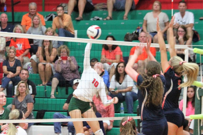 LCHS junior outside hitter Autumn Hoffert (10) looks for a kill aginst Rochester Tuesday night. Photo by Sam Wood/The Courier