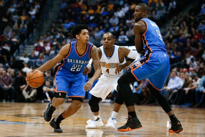 Oklahoma City Thunder forward Serge Ibaka (9) defends as guard Cameron Payne (22) dribbles the ball around Denver Nuggets guard Randy Foye (4) in the fourth quarter at the Pepsi Center in Denver on Jan. 19, 2016. Isaiah J. Downing-USA TODAY Sports
