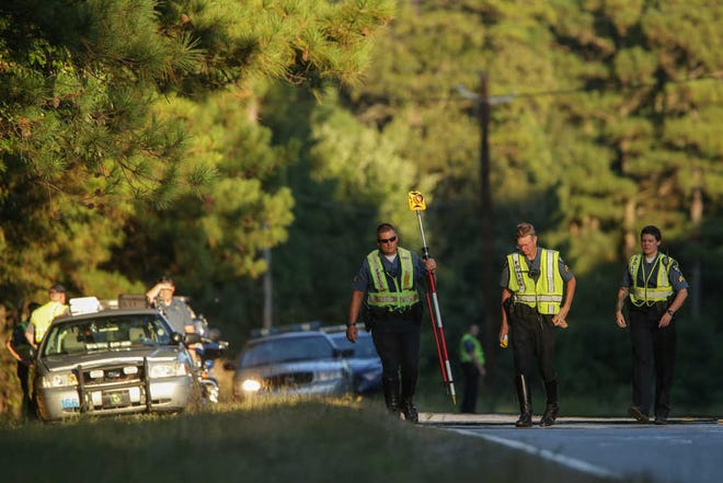 Athens-Clarke County police investigate the scene along Athena Dr. where a cyclist was struck and killed while two other cyclists sustained injuries when a Jeep hit them, Wednesday, September 14, 2016. (Photo/ John Roark, Athens Banner-Herald)