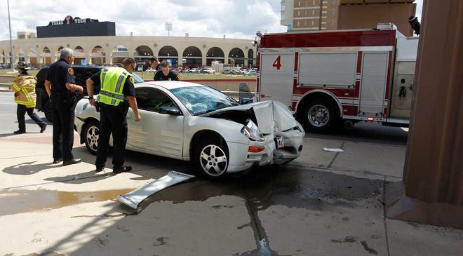 Scene of a traffic accident where a car ran into a pedestrian bridge support at the intersection of Boston Ave. and Marsha Sharp Freeway, Thursday afternoon, September 1, 2016, in Lubbock Texas. Photo by Mark Rogers