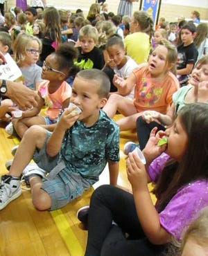 Northwest students try a taste of avocados Wednesday at an all school assembly in the gym. In front from left are: Rosalee Polen, Tylayah Hunt, Urijah Power and Alexis Sherren. Behind them from left are: Jaiden Marshall, Kyah Carter, Jozalynn Babbs and Makayla Ginger. Seen in the back is David Bone. Photo by Jean Ann Miller/The Courier