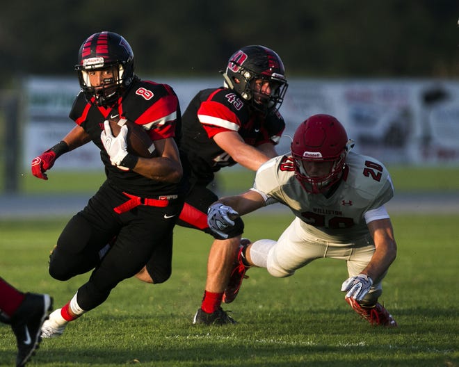 Dunnellon's Jase Williams (8) is averaging nine yards a carry and has scored four rushing touchdowns this season for the Tigers. (Cyndi Chambers/Correspondent)